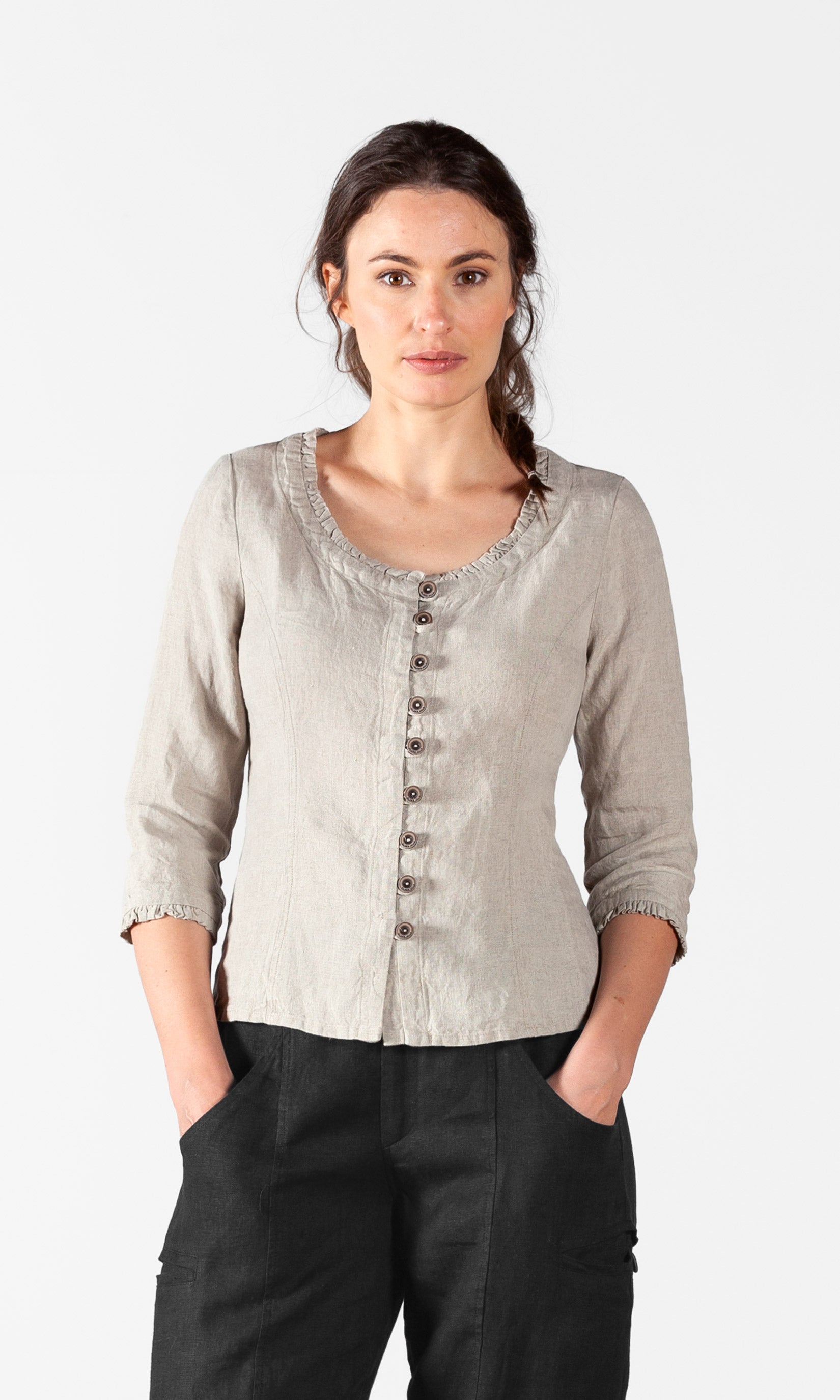 Linen blouse with fastening, ruffle details and three-quarter sleeve