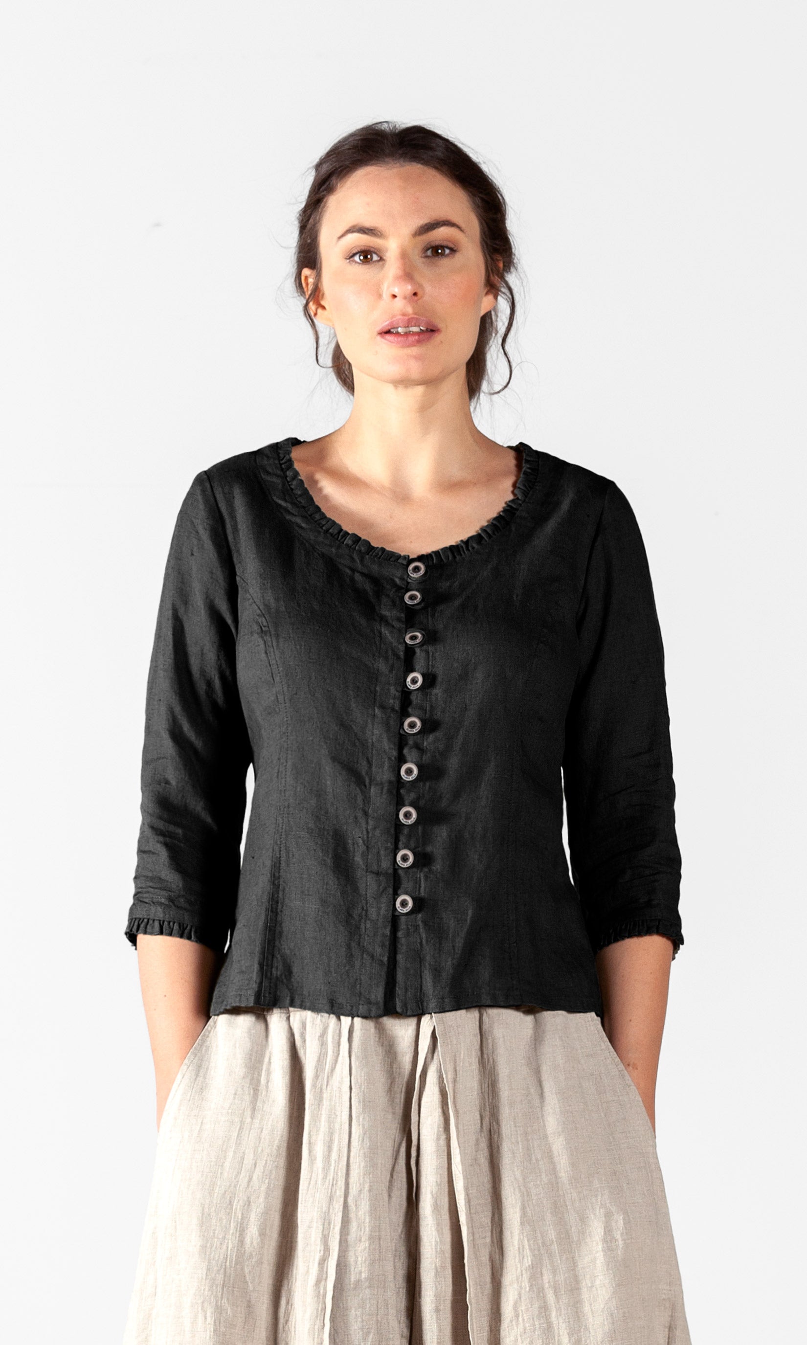 Linen blouse with fastening, ruffle details and three-quarter sleeve