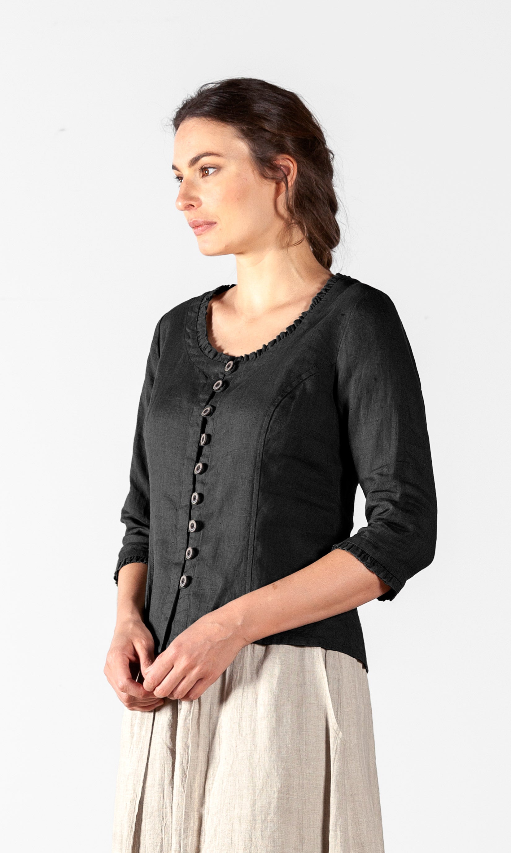 Linen blouse with fastening, ruffle details and three-quarter sleeve