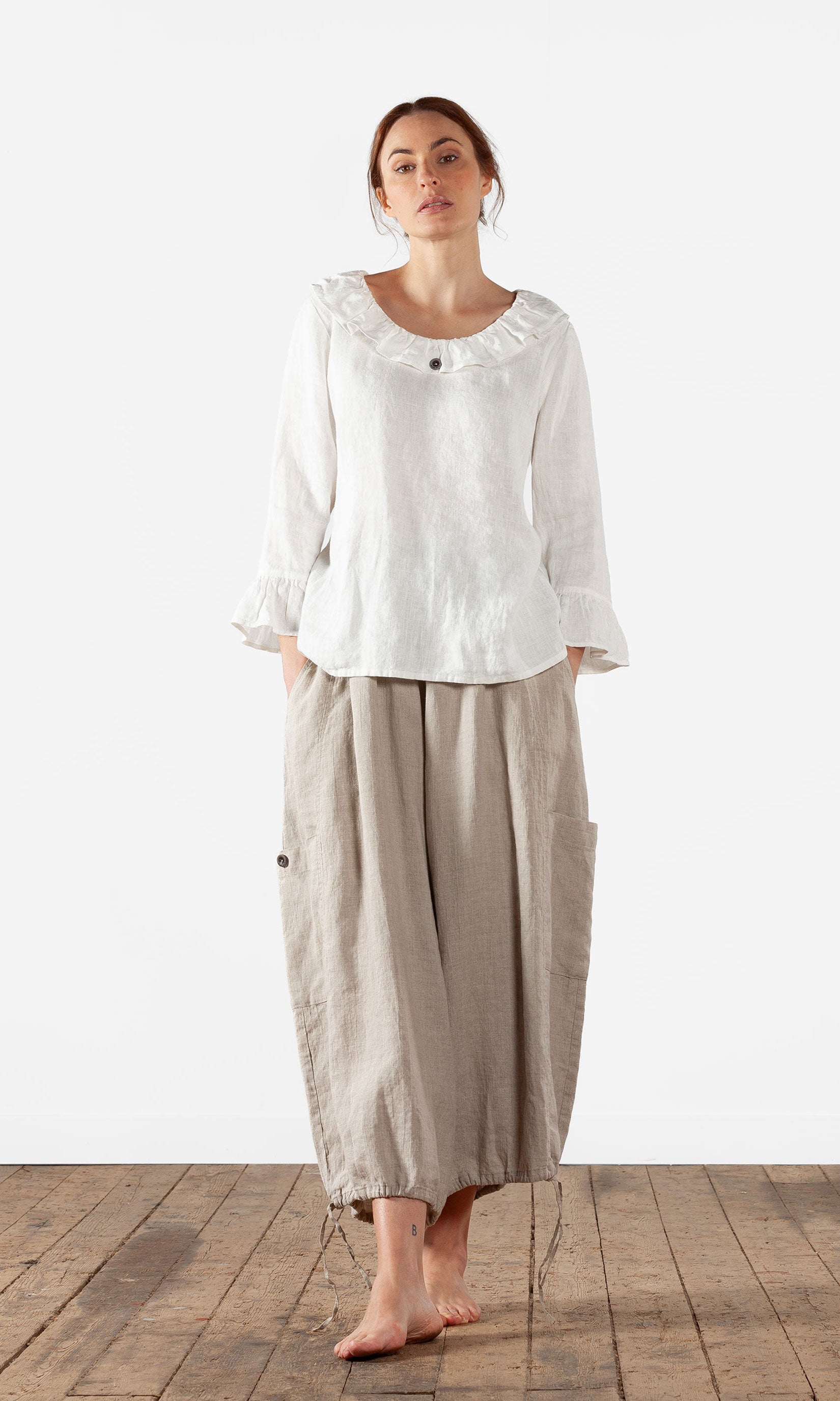 Straight blouse with ruffles in linen