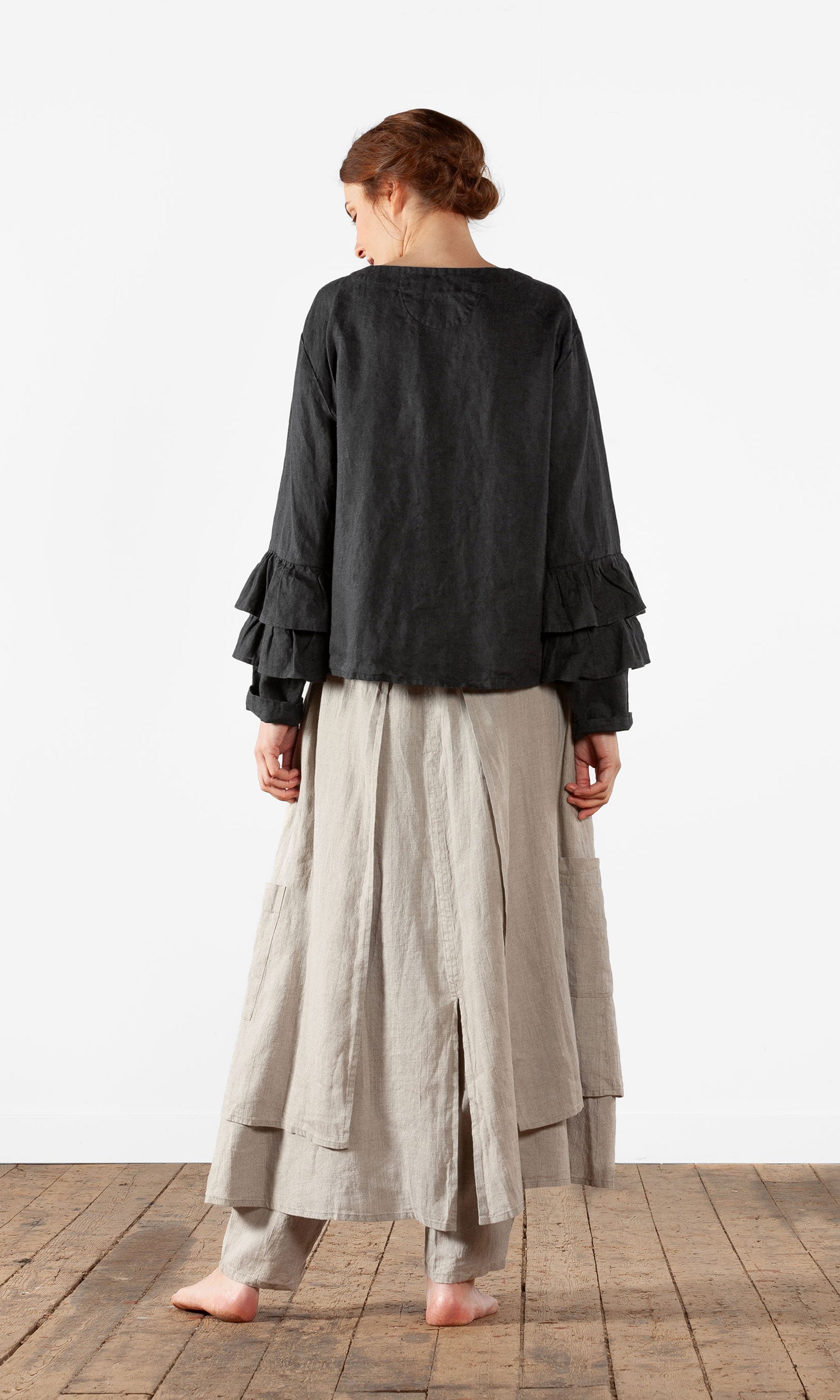 Linen blouse with ruffles and wrap-around buttoning