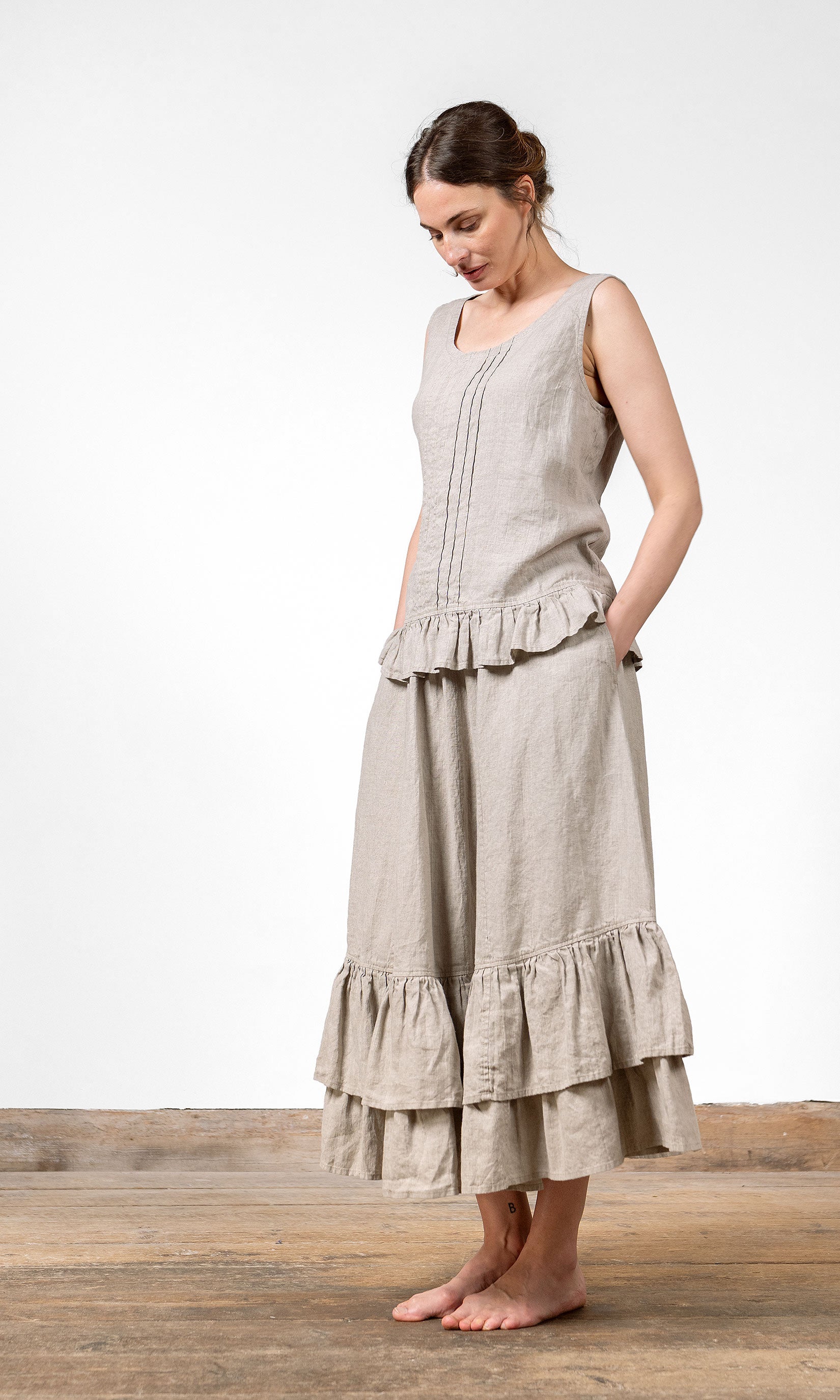 Linen blouse with gathered ruffle edge and decorative pleats