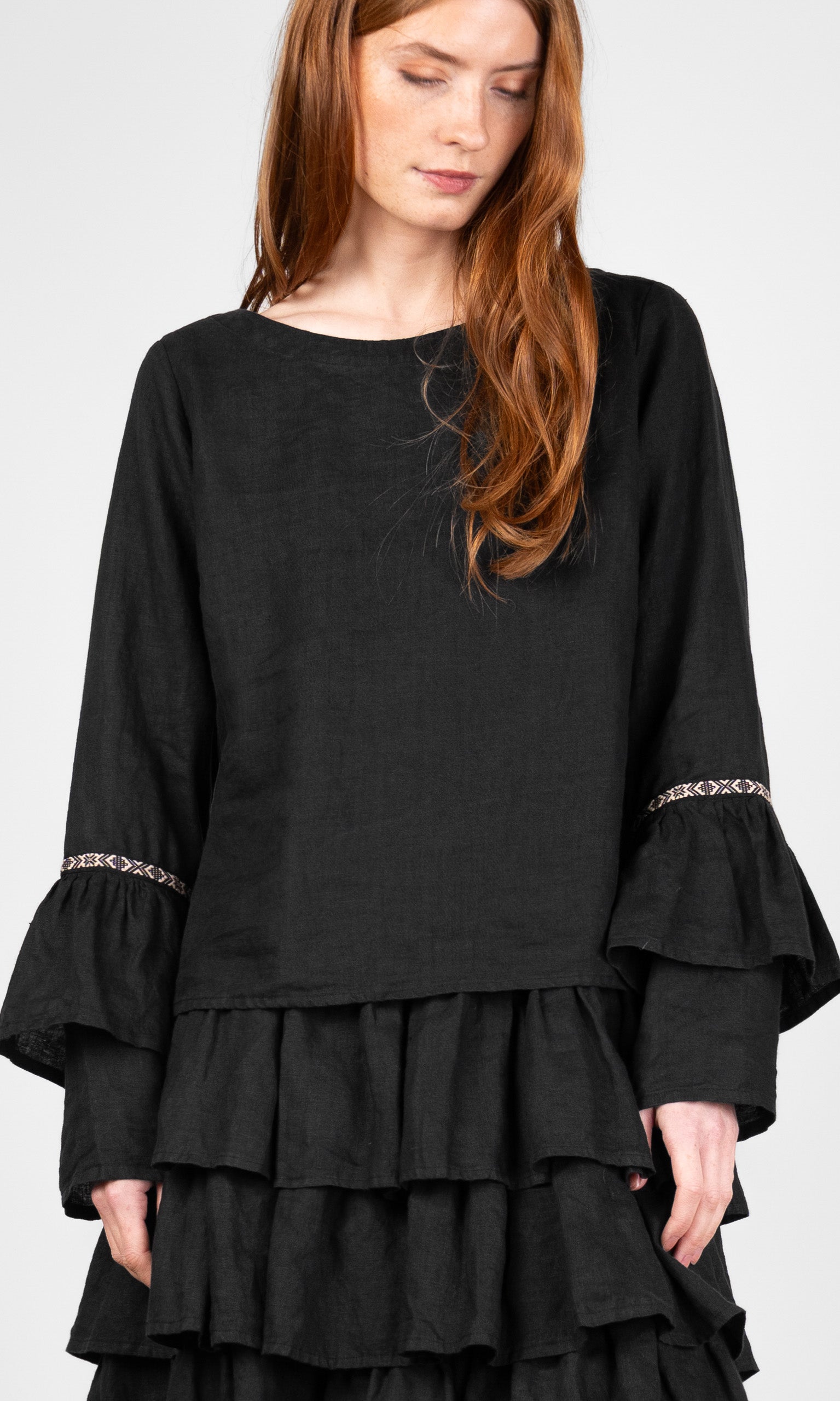 Linen blouse with ruffled sleeves and decorative ribbon