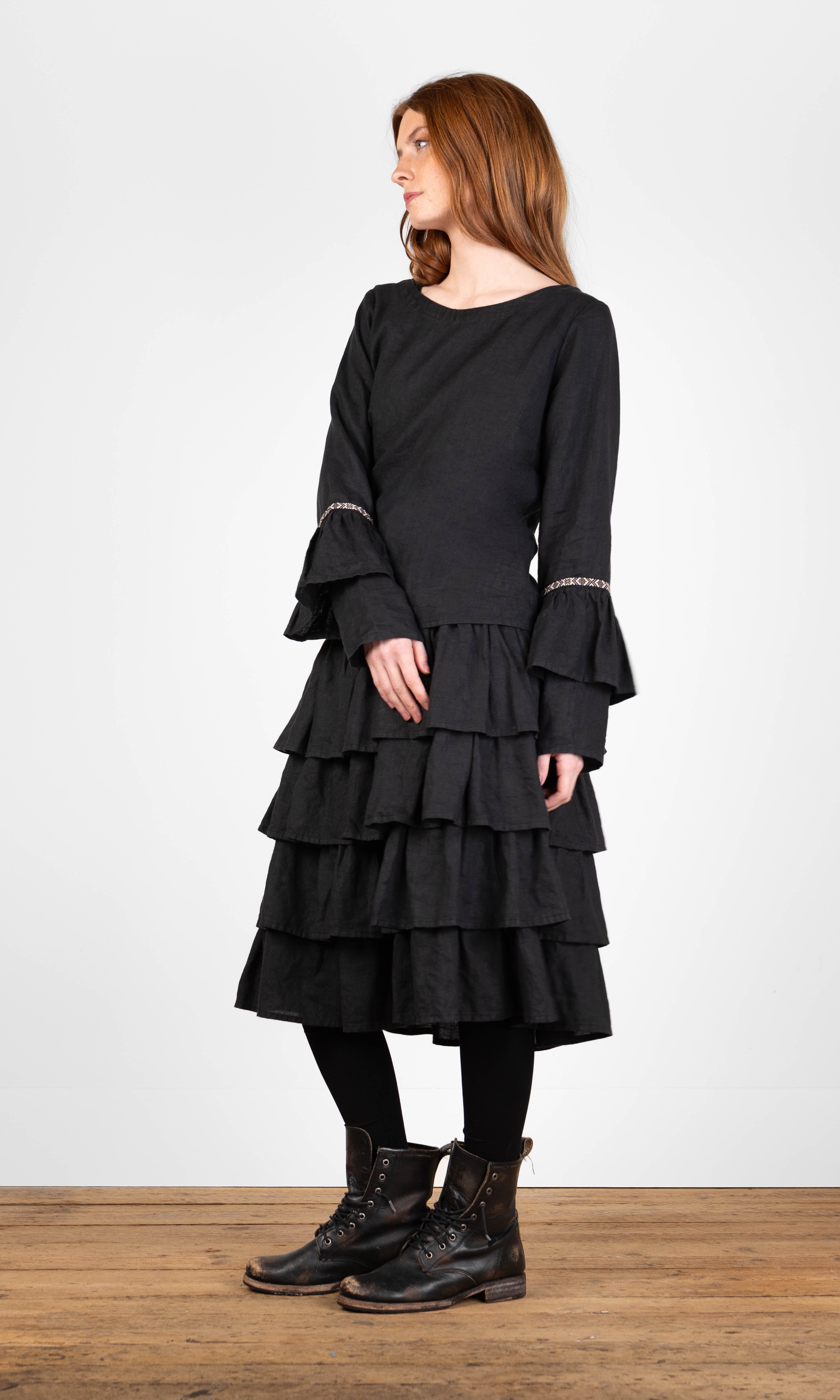 Linen blouse with ruffled sleeves and decorative ribbon