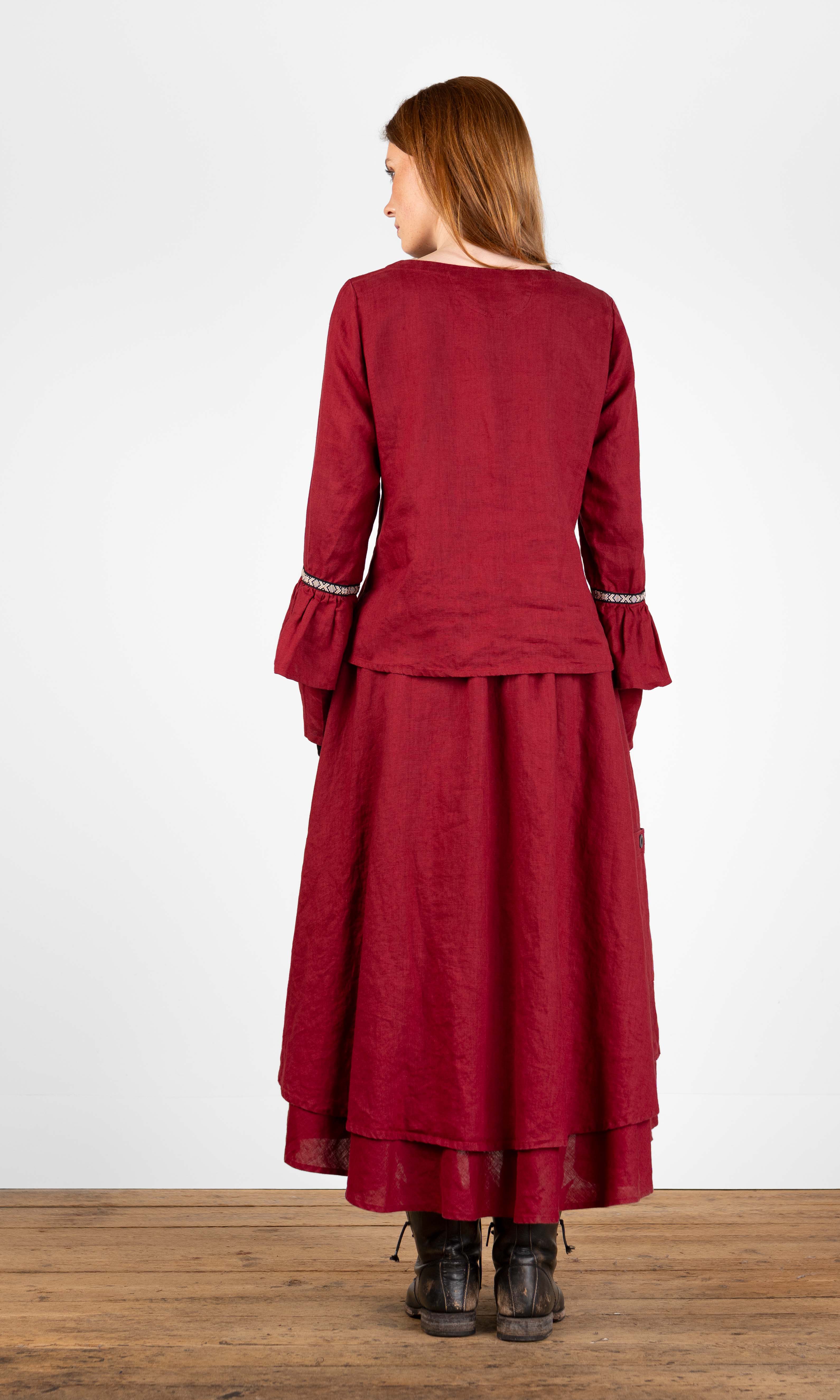 Linen blouse with ruffled sleeves and decorative ribbon