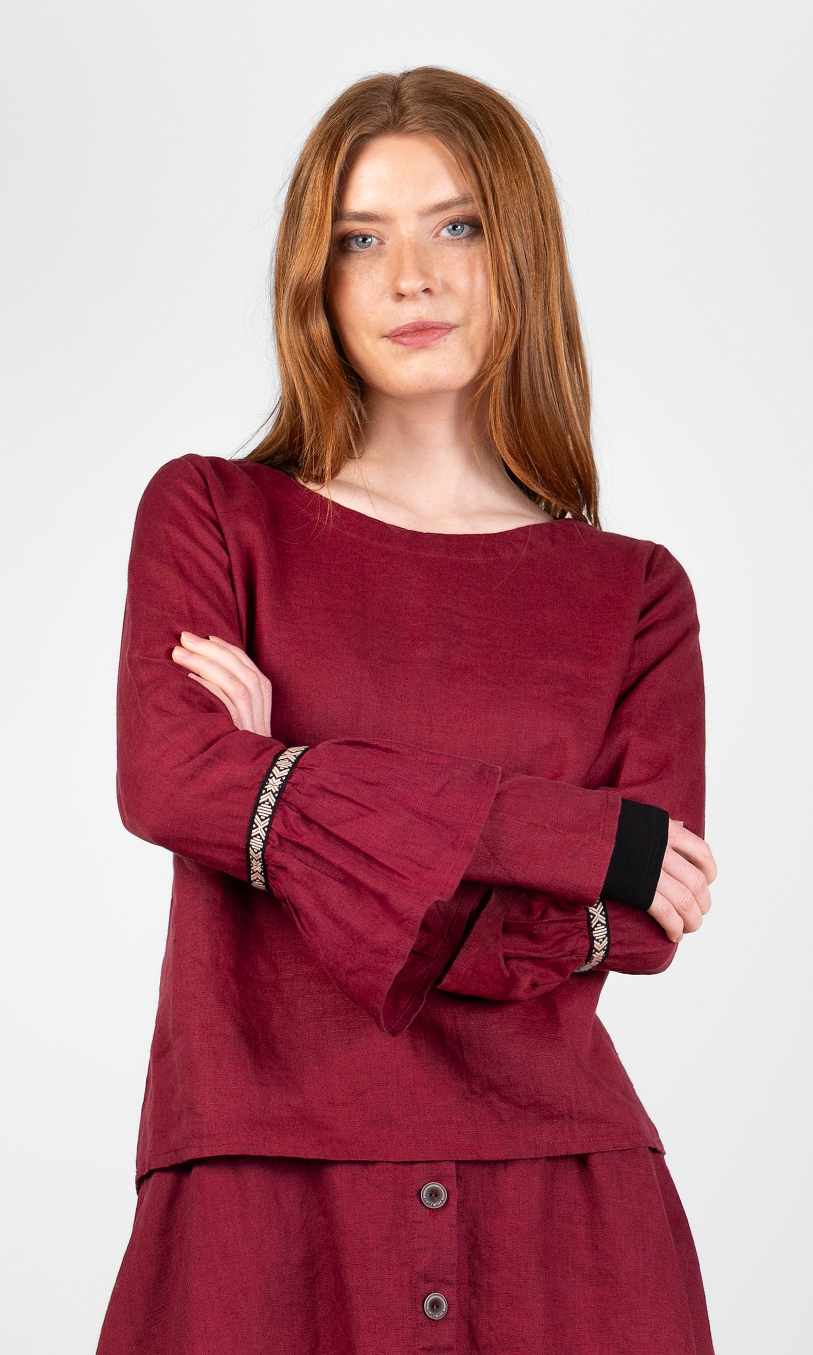 Linen blouse with ruffled sleeves and decorative ribbon