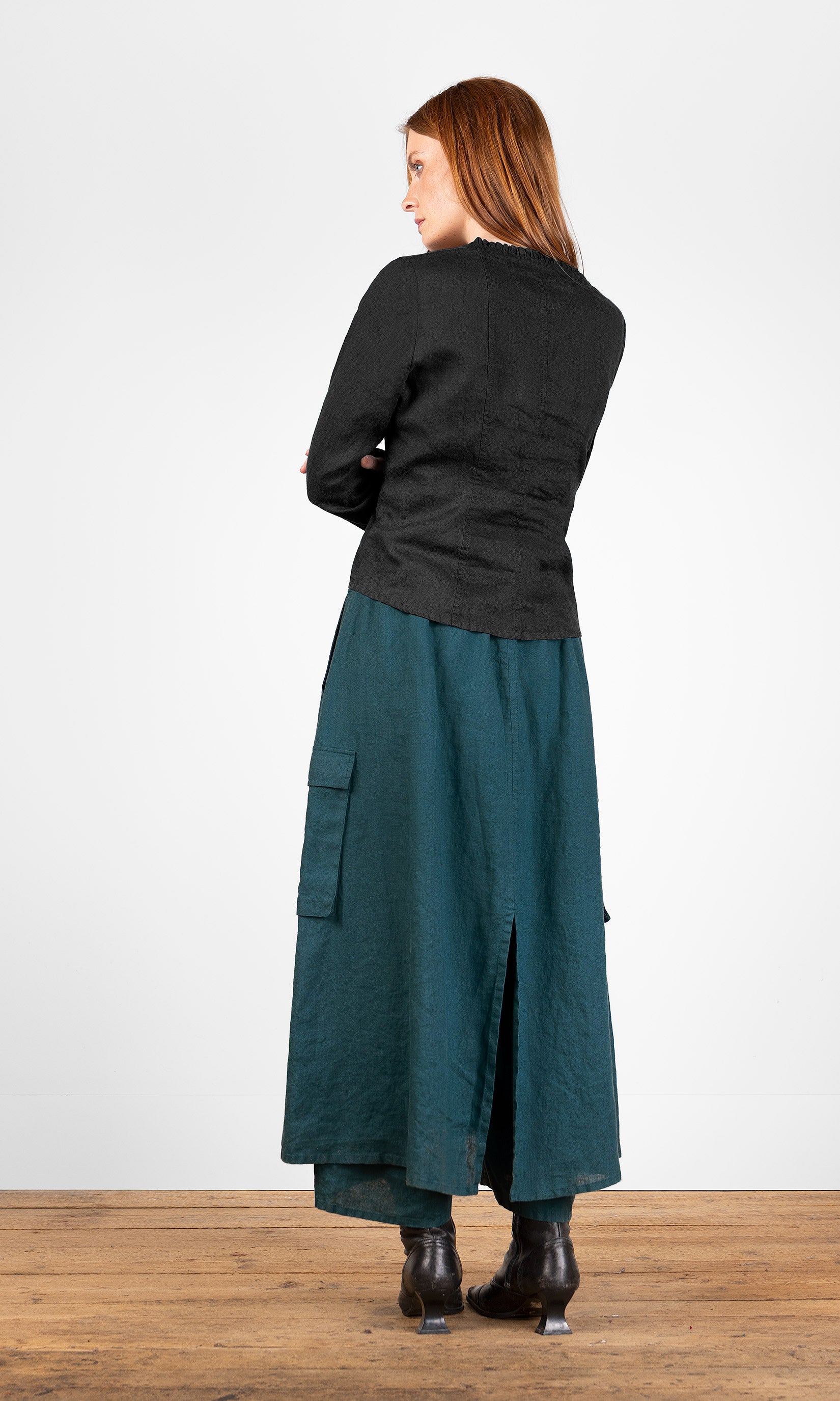 Fitted black blouse with ruffle details