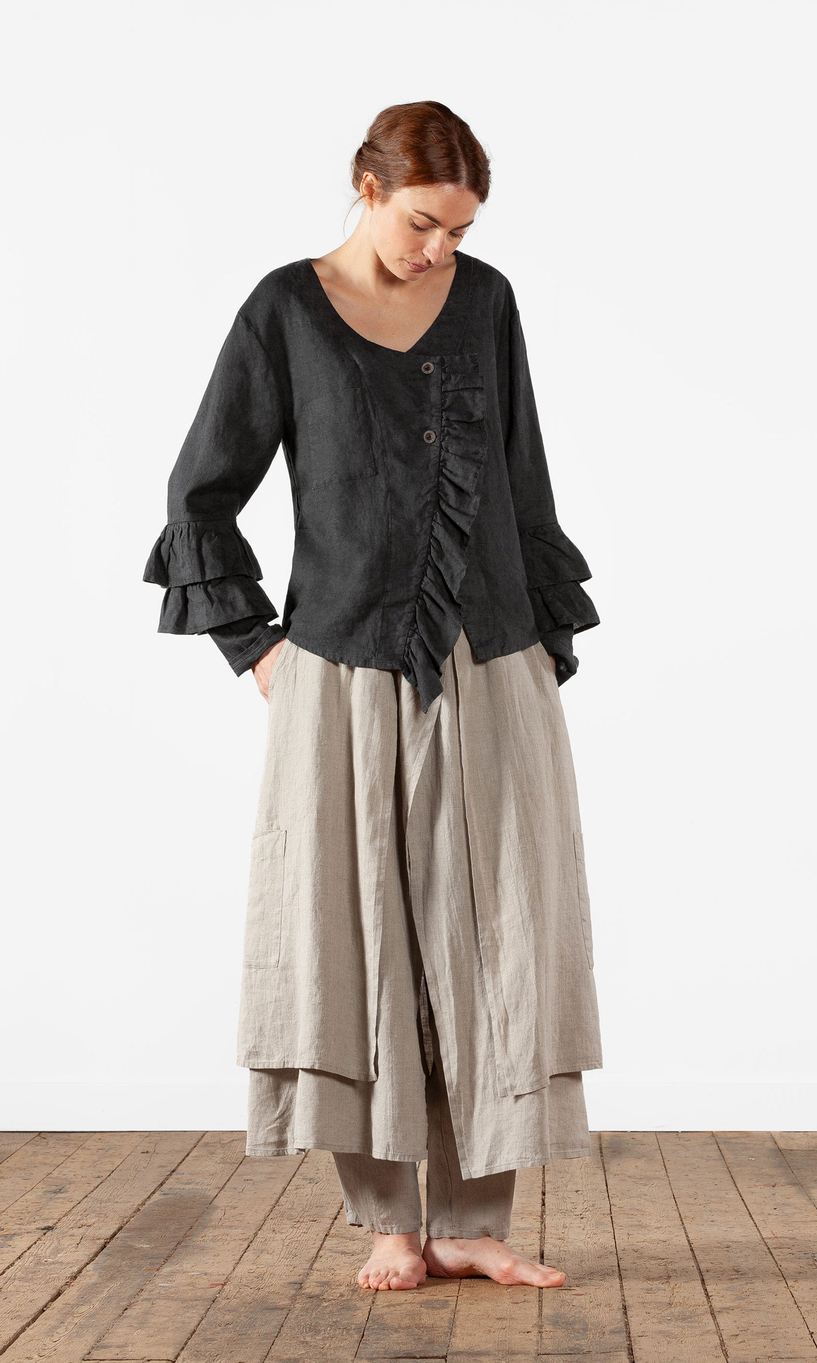 Linen blouse with ruffles and wrap-around buttoning