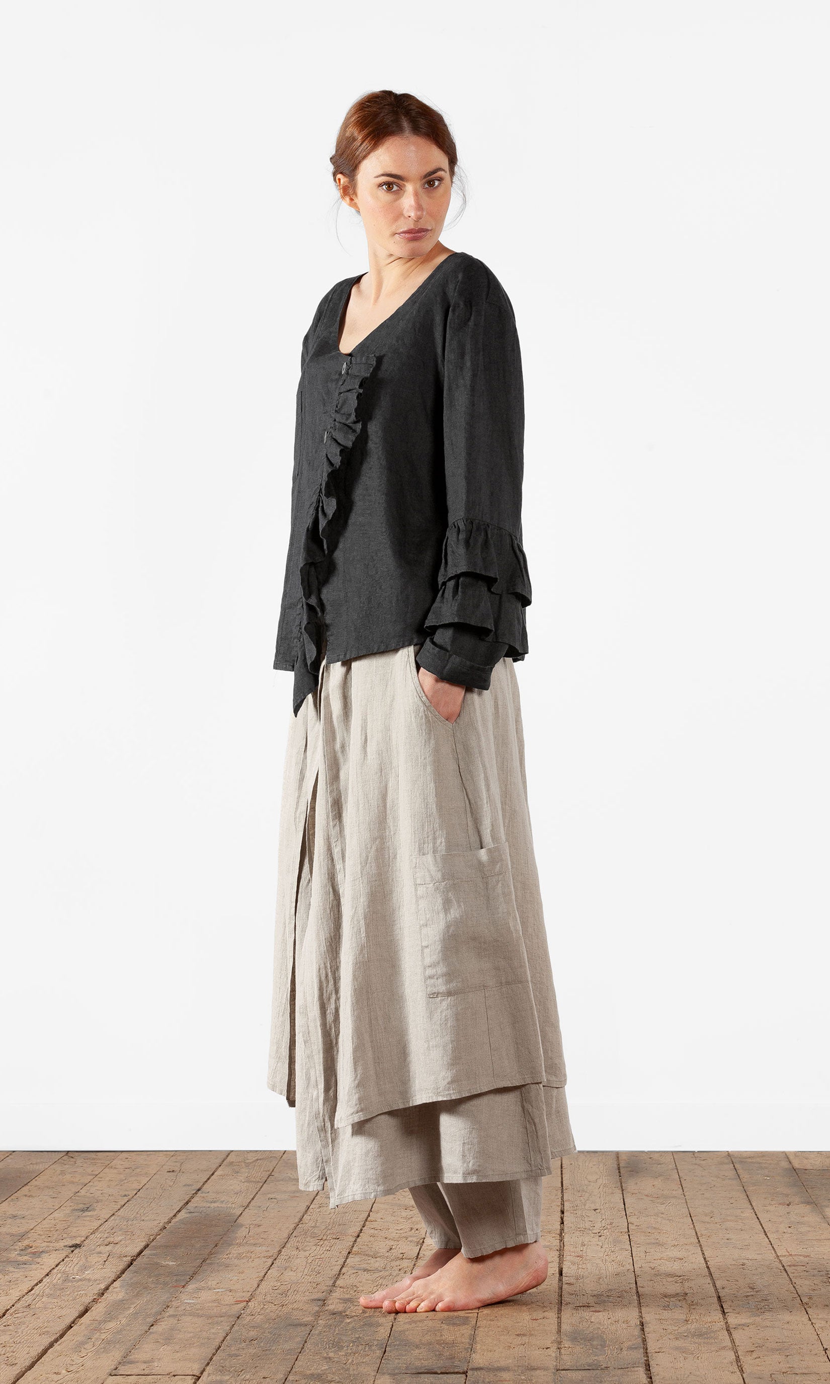 Linen blouse with ruffles and wrap-around buttoning