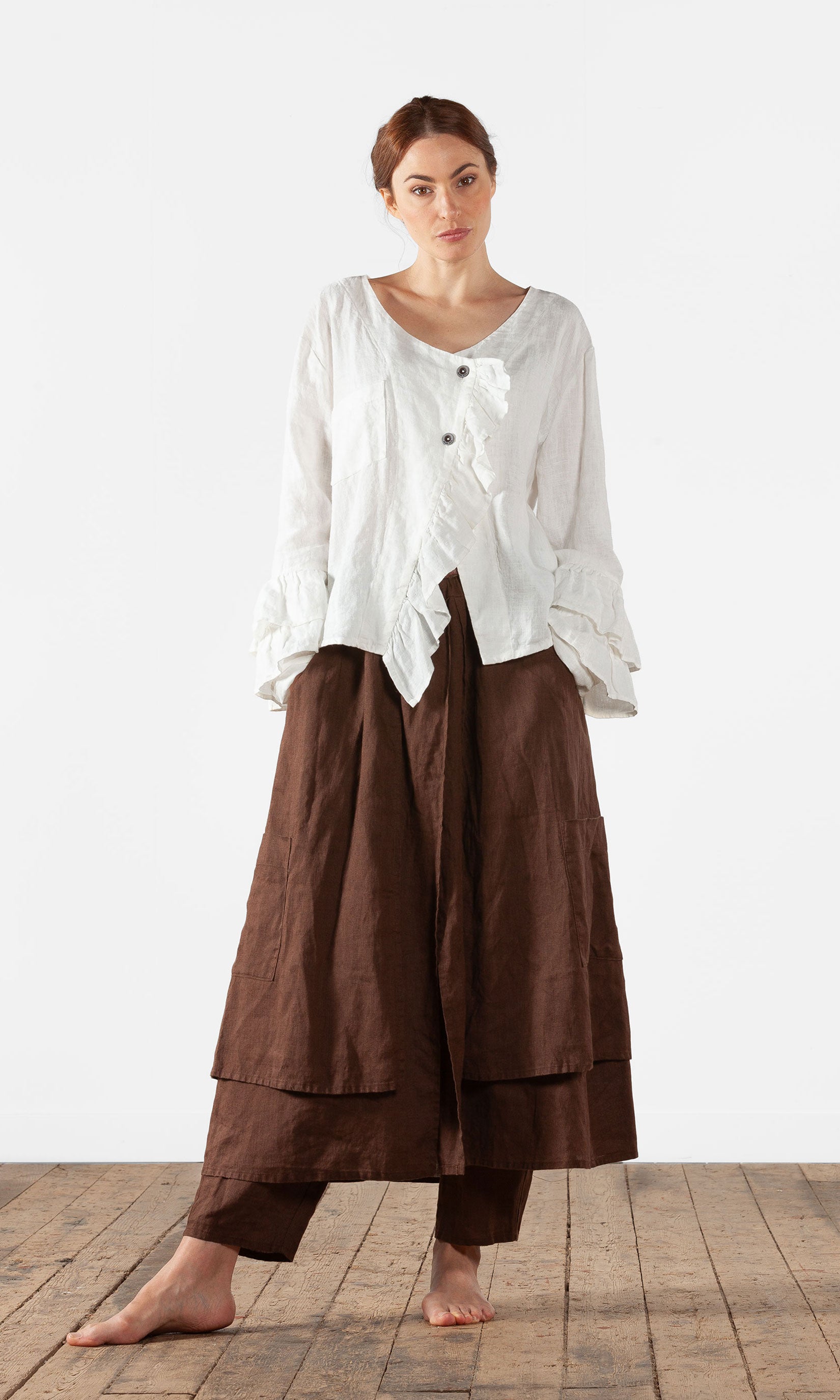 Linen blouse with ruffles and wrap-around buttoning