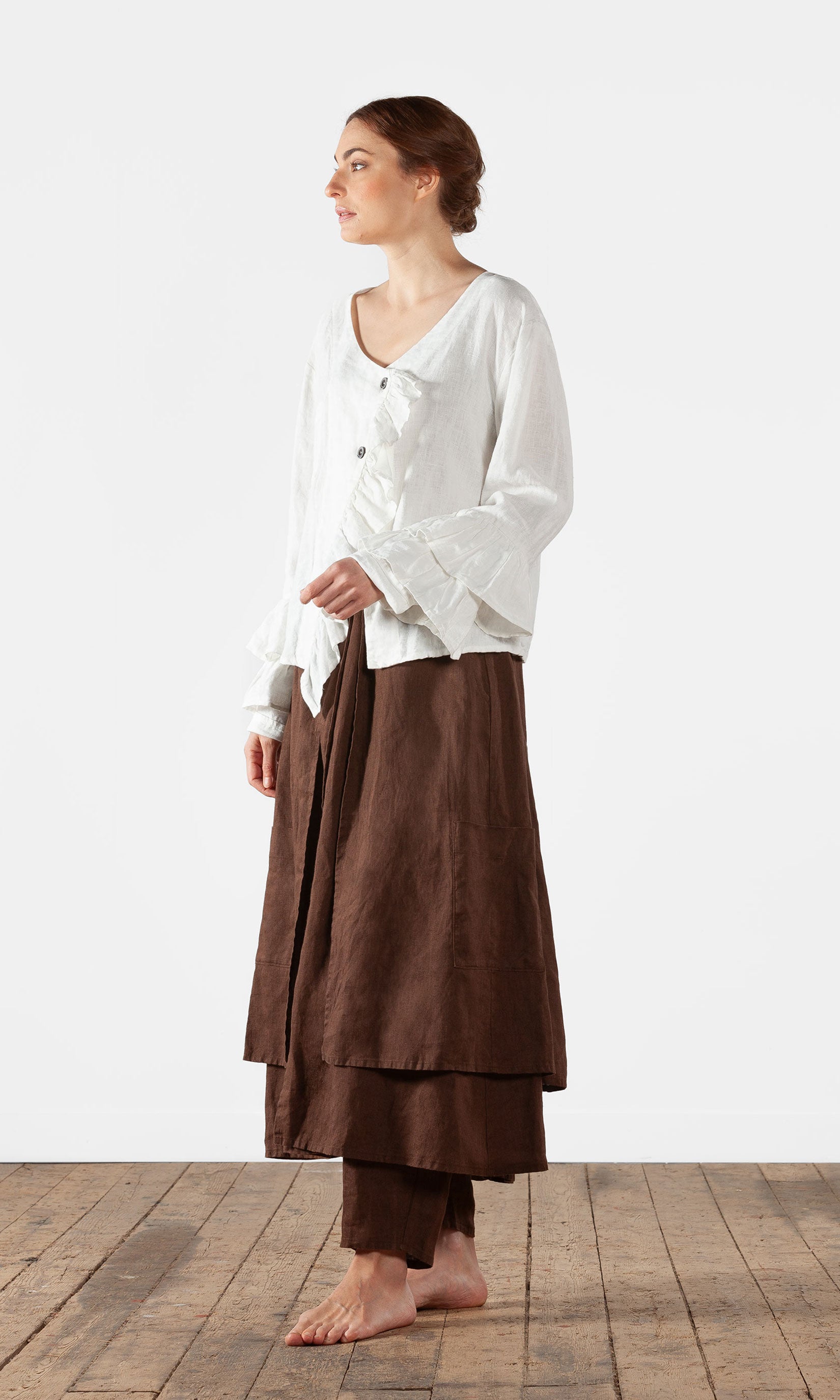 Linen blouse with ruffles and wrap-around buttoning