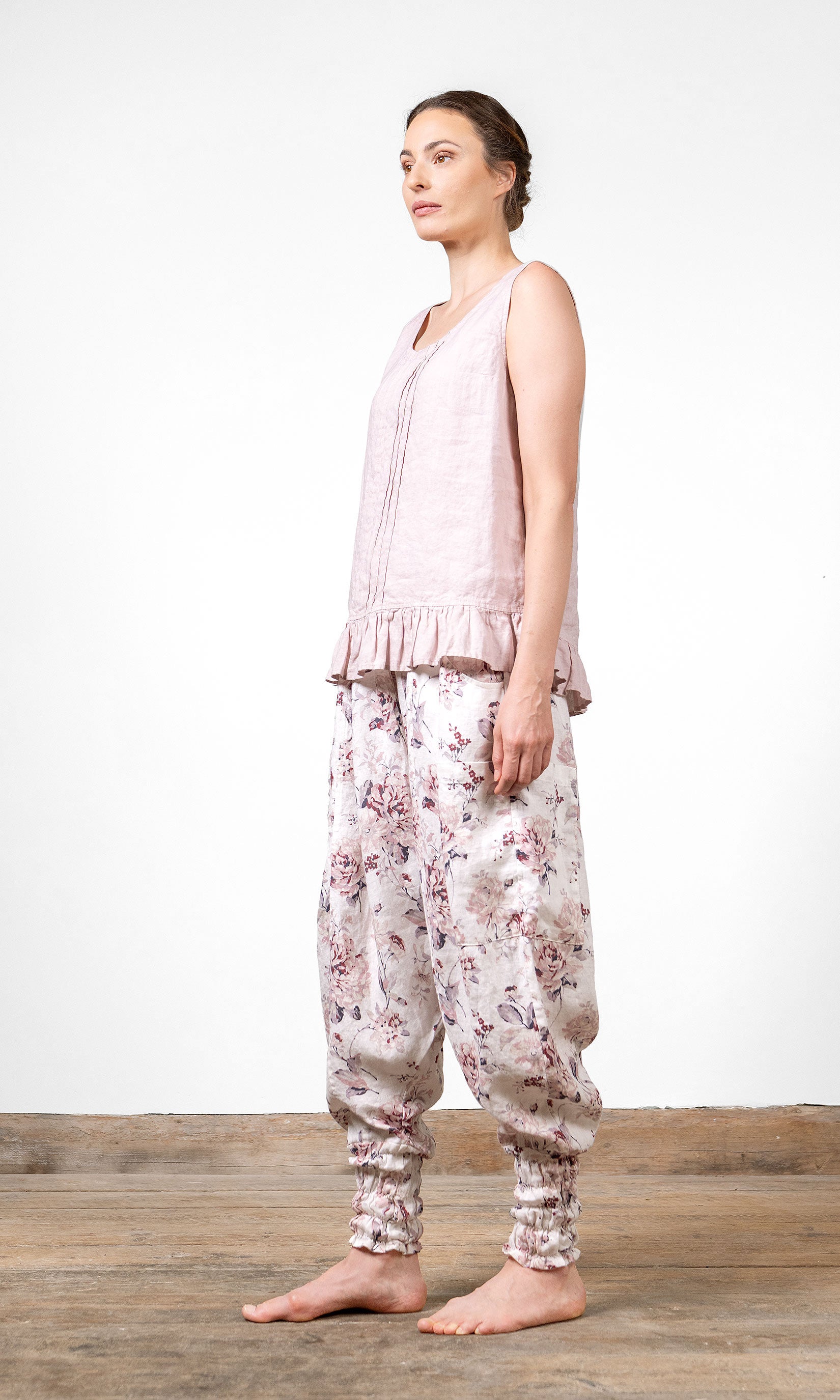 Linen blouse with gathered ruffle edge and decorative pleats