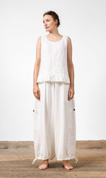 Linen blouse with gathered ruffle edge and decorative pleats