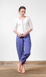 Linen blouse with fastening, ruffle details and three-quarter sleeve